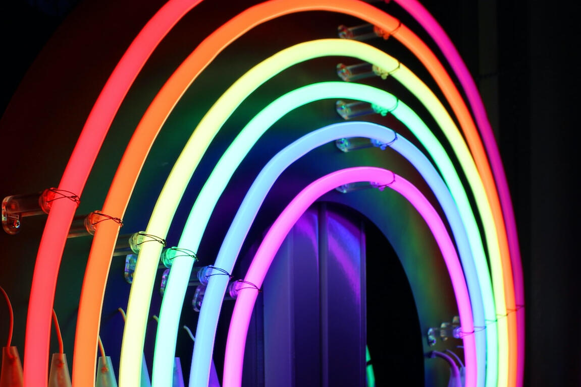 Rainbow-colored neon decor, by Ana Cruz on Unsplash